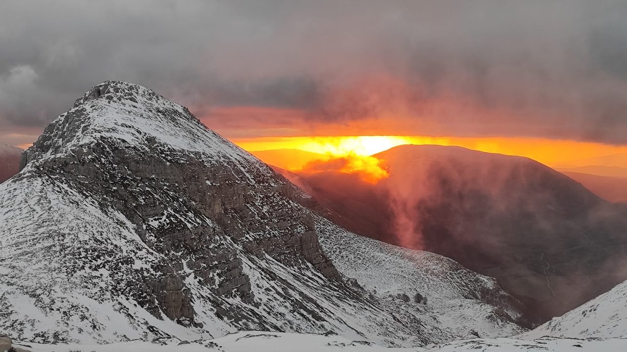 Snow-covered mountains at sunset